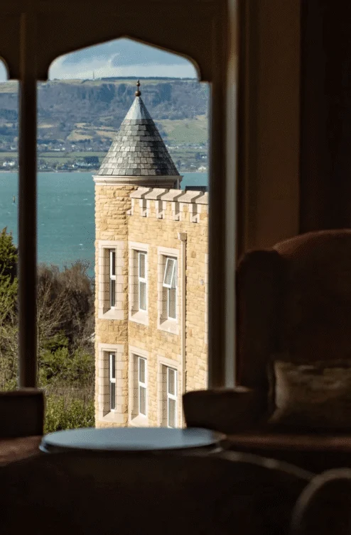 Cosy seating area with picturesque sea and countryside view.