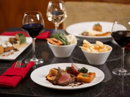 Elegant dining setting with gourmet dishes and wine, perfect for a family celebration.