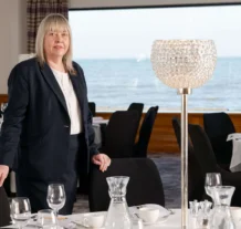 Elegant dining space with sea view at Hastings Hotels.