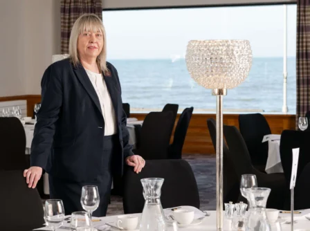 Elegant dining space with sea view at Hastings Hotels.