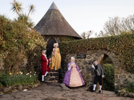 Family in period costumes enjoying a garden at Hastings Hotels.