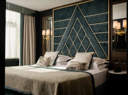 Elegant hotel room with stylish decor, featuring a comfy double bed and soft lighting.