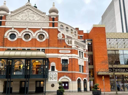 Historic Grand Opera House exterior with intricate brickwork, a popular tourist attraction in Belfast.