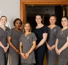 Friendly hotel staff at The Spa at Culloden, welcoming guests in a warm, elegant setting.