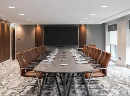 Spacious, modern conference room with elegant furnishings at Hastings Hotels.