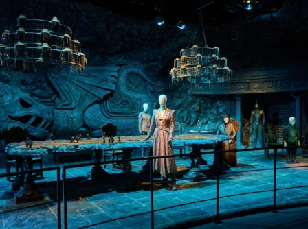 A family exploring an elegant, themed dining area with intricate wall carvings.