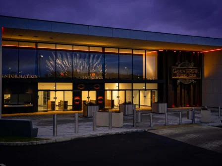 Modern building at dusk with Game of Thrones Studio Tour entrance sign.