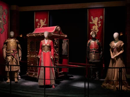 Medieval-themed display with lifelike mannequins in ornate costumes at Hastings Hotels.
